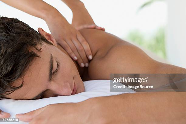man having a massage - massage therapy stock pictures, royalty-free photos & images