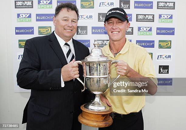 Nathan Green of Australia holds the trophy with Mark Bryers, Deputy Chairman of Bluechip after winning the New Zealand Open at Gulf Harbour Country...