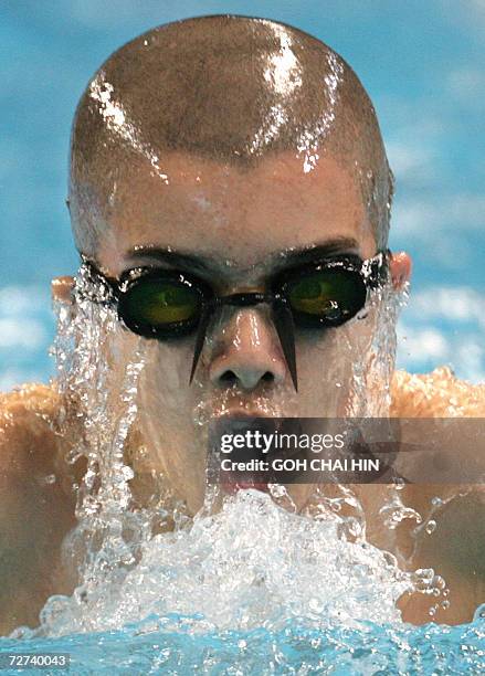 Ten-year-old Amer Ali of Iraq competes in heat 2 of the men's 200m individual medley swimming event at the Hamad Aquatic Centre during the 15th Asian...