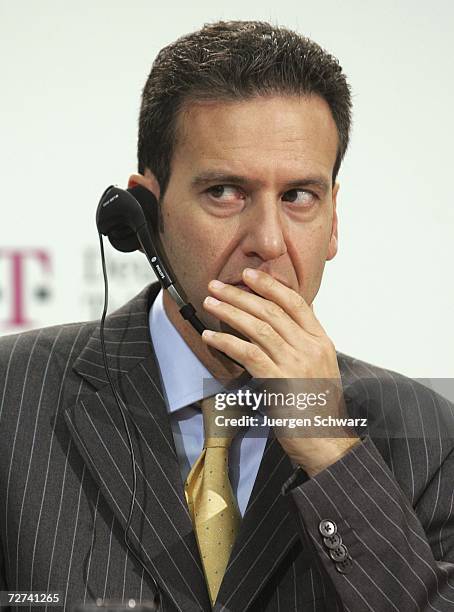 Mobile CEO and Deutsche Telekom board member Hamid Akhavan listens to questions from journalists at a news conference December 6, 2006 in Bonn,...