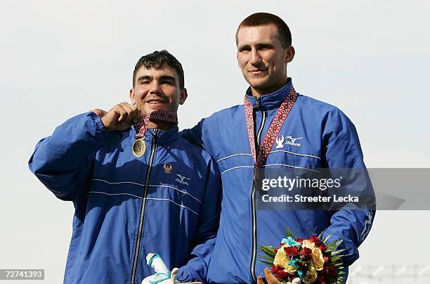 Ruslan Naurzaliyev amd Vladimir Cherneko of Team Uzbekistan celebrate after winning the Gold Medal in the Men's Double Sculls Rowing Competition...