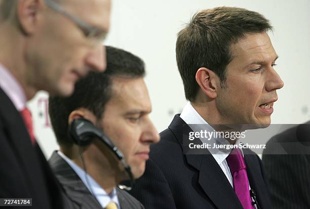 Deutsche Telekom CEO Rene Obermann talks beside new Board of Management members Timotheus Hoettges and T-Mobile CEO Hamid Akhavanat at a news...