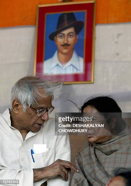 Trinamool Congress chief Mamata Banerjee speakes with NDA Convenor George Fernandesges sitting infront of a photograph of Indian freedom movement...