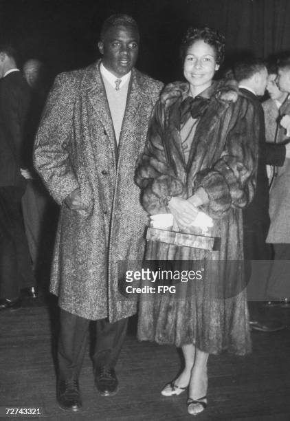 Retired baseball player Jackie Robinson and his wife Rachel at the Seventh Regiment Armory to attend a benefit tennis match for Art Larsen who was...
