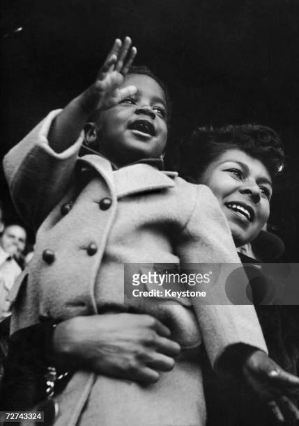 Rachel Robinson, wife of Brooklyn Dodgers baseball player Jackie Robinson, and their son Jackie Jnr at the Polo Grounds during the Memorial Day...