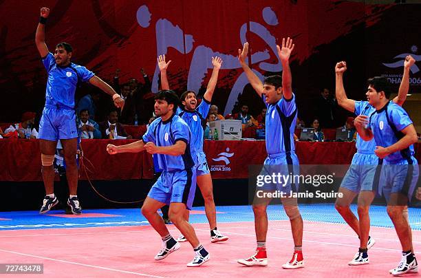 The Indian team celebrate winning the gold medal by defeating Pakistan in the Men's Kabaddi Gold Medal match at the 15th Asian Games Doha 2006 at...