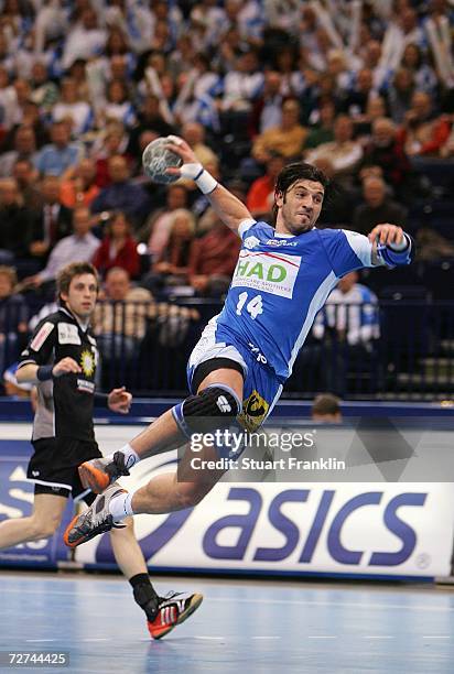 Bertrand Gille of Hamburg throws a goal during the Bundesliga game between HSV Handball and TUS N-Luebbecke at the Color Line Arena on December 6,...