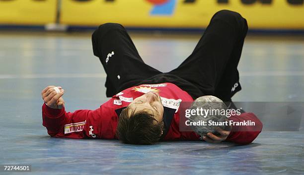 Birkir Gudmundsson of Lubeck lays on the floor looking dejected after a goal during the Bundesliga game between HSV Handball and TUS N-Luebbecke at...