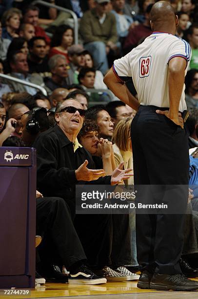 Actor Jack Nicholson talks with referee Derek Richardson during the game between the Los Angeles Lakers and the Toronto Raptors on November 17, 2006...