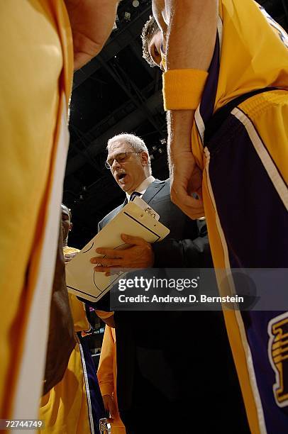 Head coach Phil Jackson of the Los Angeles Lakers draws up a play in the huddle during the game against the Toronto Raptors on November 17, 2006 at...