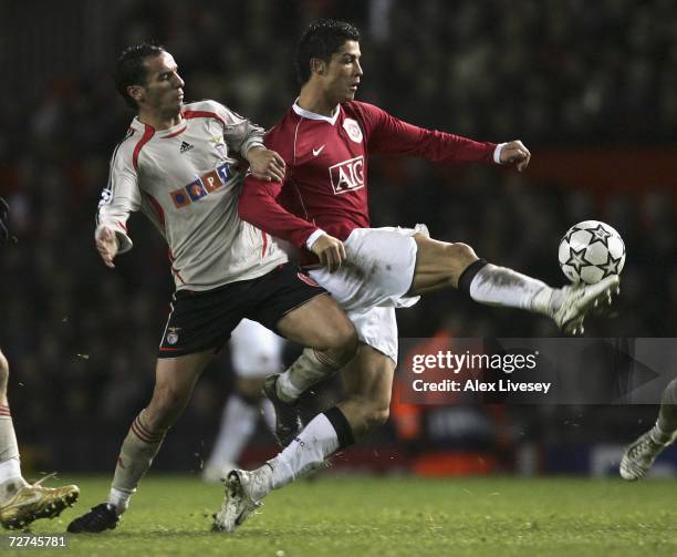 Cristiano Ronaldo of Manchester United is challenged by Petit of Benfica during the UEFA Champions League Group F match between Manchester United and...