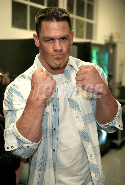 Pro wrestler John Cena poses...