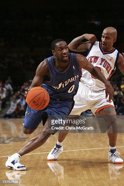 Gilbert Arenas of the Washington Wizards drives past Stephon Marbury of the New York Knicks on December 06, 2006 at Madison Square Garden in New York...