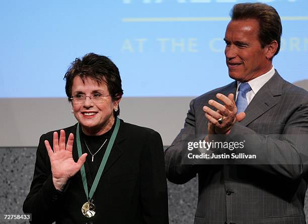 California governor Arnold Schwarzenegger applauds former tennis star Billie Jean King after she was inducted into the California Hall of Fame...