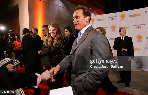 California Gov. Arnold Schwarzenegger and his wife, first lady Maria Shriver greet guests at the induction ceremony for the California Hall of Fame...