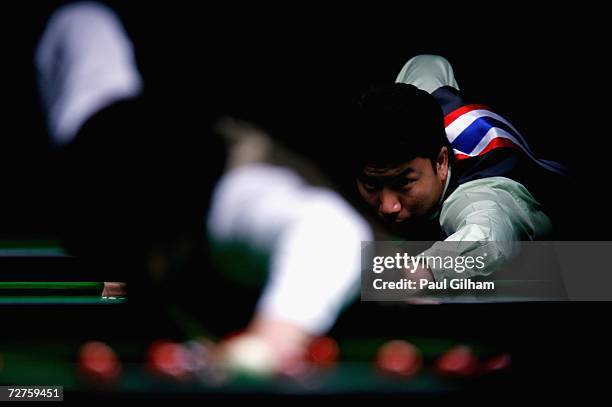 Fu Ka Chun Marco of Hong Kong, China lines up a shoot in his match against Do Hoang Quan of Vietnam during the Men's Snooker Singles last 16 match at...