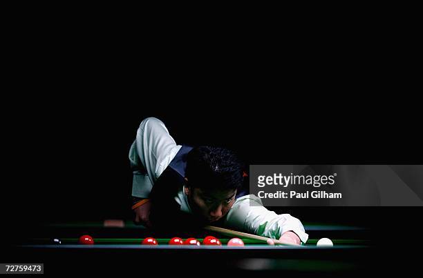 Fu Ka Chun Marco of Hong Kong, China lines up a shoot in his match against Do Hoang Quan of Vietnam during the Men's Snooker Singles last 16 match at...