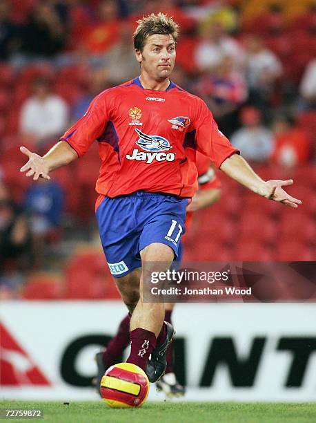 Damien Mori of the Roar looks for a pass during the round 16 Hyundai A-League match between the Queensland Roar and the Newcastle Jets at Suncorp...