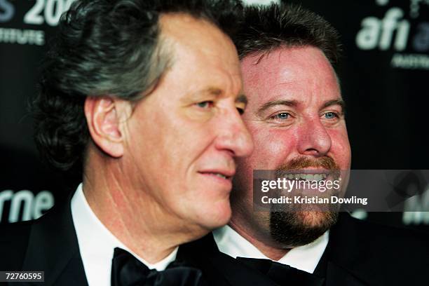 Awards host Geoffrey Rush poses with actor Shane Jacobson and Shane's award for Best Actor in a Lead Role for "Kenny" backstage at the L'Oreal Paris...