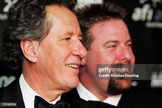 Awards host Geoffrey Rush poses with actor Shane Jacobson and Shane's award for Best Actor in a Lead Role for "Kenny" backstage at the L'Oreal Paris...
