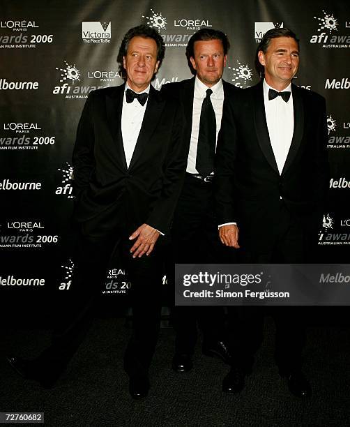 Victorian politicians and awards host Geoffrey Rush pose backstage at the L'Oreal Paris 2006 AFI Awards at the Melbourne Exhibition Centre on...