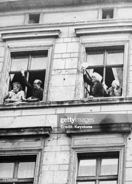 Relatives of newlyweds Dieter and Monika Marotz of Bernauerstrasse, Berlin, wave to the couple after their wedding, 8th September 1961. Although the...