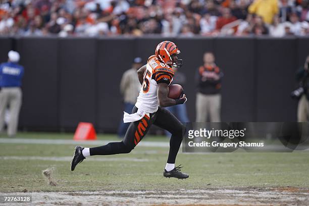 Wide receiver Chad Johnson of the Cincinnati Bengals runs with the ball against the Cleveland Browns at Cleveland Browns Stadium on November 26, 2006...