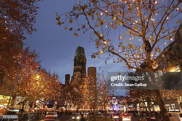 Lights hang on trees during the Christmas shopping season on Kurfuerstendamm avenue, Berlin's most famous shopping street, December 7, 2006 in...