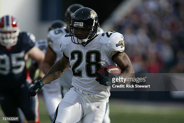 Running back Fred Taylor of the Jacksonville Jaguars carries the ball against the Buffalo Bills on November 26, 2006 at Ralph Wilson Stadium in...