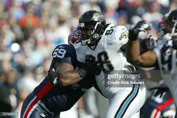 Defensive tackle John Henderson of the Jacksonville Jaguars rushes against offensive lineman Mike Gandy of the Buffalo Bills on November 26, 2006 at...