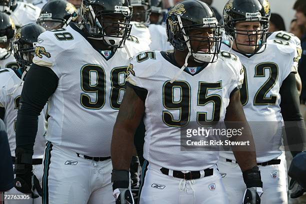 Defensive linemen John Henderson, Paul Spicer and Rob Meier of the Jacksonville Jaguars wait to enter the field before the game against the Buffalo...