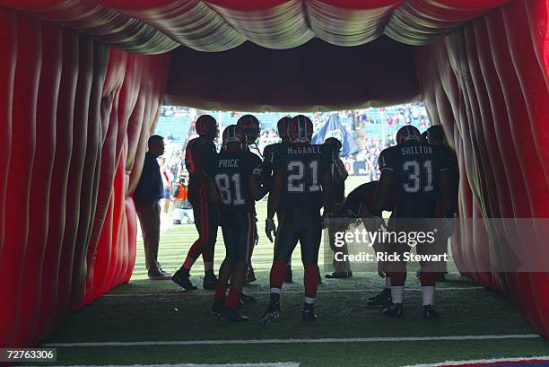 Wide receiver Peerless Price, running back Willis McGahee and fullback Daimon Shelton of the Buffalo Bills stand in the tunnel before the game...