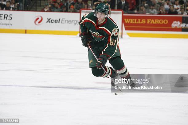 Benoit Pouliot of the Minnesota Wild skates against the Phoenix Coyotes during the game at Xcel Energy Center on November 24, 2006 in Saint Paul,...