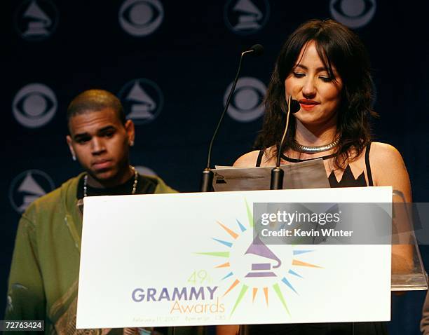 Singer KT Tunstall announces the " Best Contemporary Folk/Americana Album" nominees as singer Chris Brown looks on during the 49th annual Grammy...