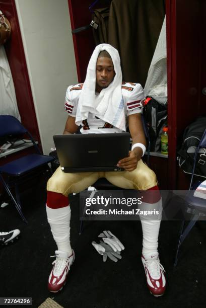 Brandon Williams of the San Francisco 49ers uses his computer in the locker room before the game against the New Orleans Saints at the Louisiana...