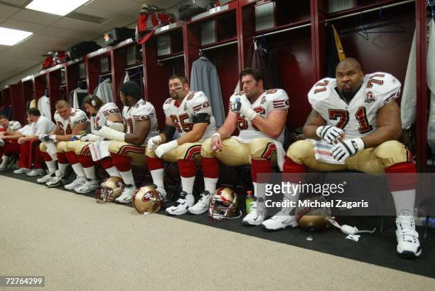 The offensive line of the San Francisco 49ers prepares in the locker room before the game against the New Orleans Saints at the Louisiana Superdome...