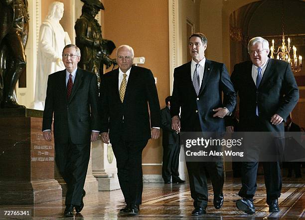 Outgoing U.S. Senate Republican Leader Bill Frist walks towards the Senate Chamber with incoming Republican Leader Mitch McConnell , U.S. Vice...