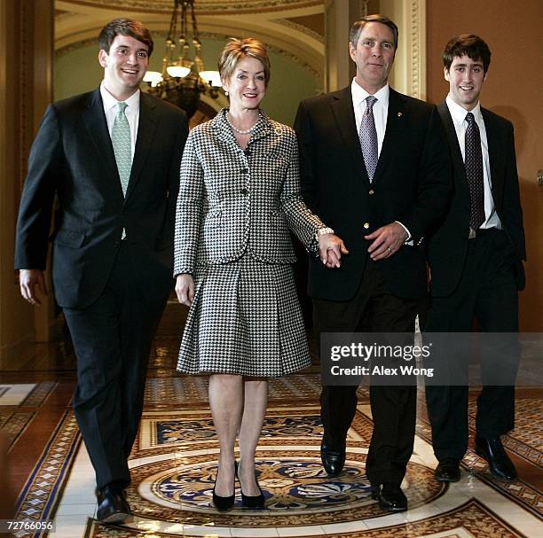 Outgoing U.S. Senate Republican Leader Bill Frist walks with wife Karyn , sons Harrison and Bryan after he gave his farewell speech in the Senate...