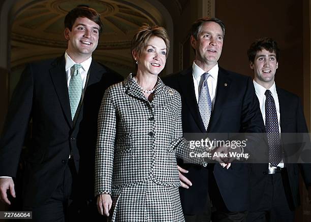 Outgoing U.S. Senate Republican Leader Bill Frist walks with wife Karyn , sons Harrison and Bryan after he gave his farewell speech in the Senate...