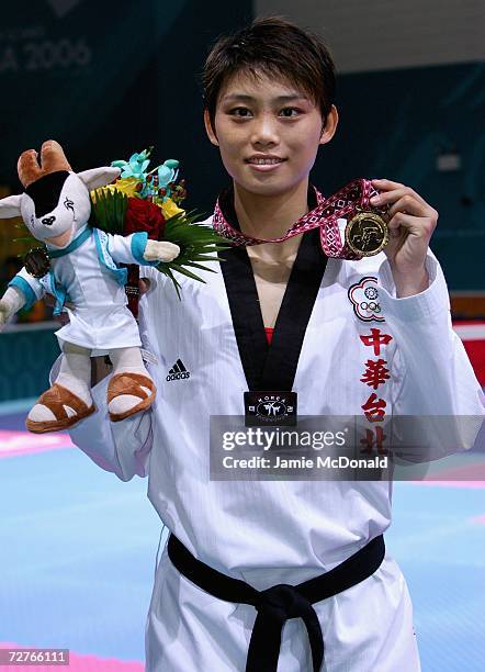 Gold Medal winner Su Li Wen of Chinese Taipei celebrates winning in the Women's 63kg Taekwondo match during the 15th Asian Games Doha 2006 at Qatar...