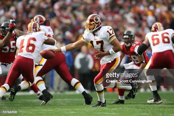 Jason Campbell of the Washington Redskins hands off to Ladell Betts against the Atlanta Falcons at the FedEx Field on December 3, 2006 in Landover,...