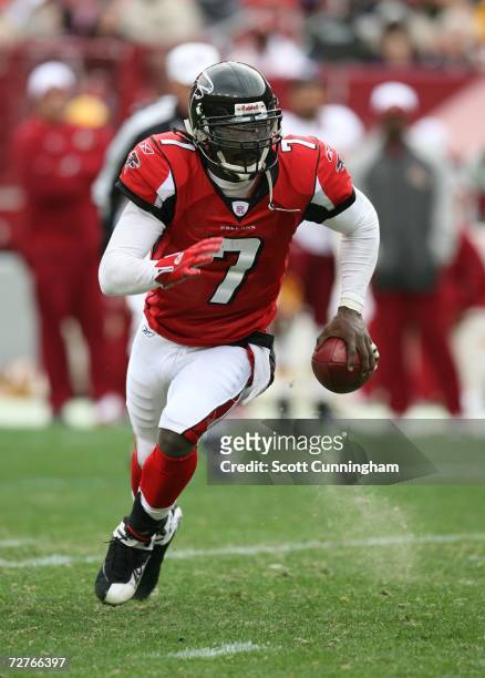 Michael Vick of the Atlanta Falcons scrambles against the Washington Redskins at the FedEx Field on December 3, 2006 in Landover, Maryland. The...