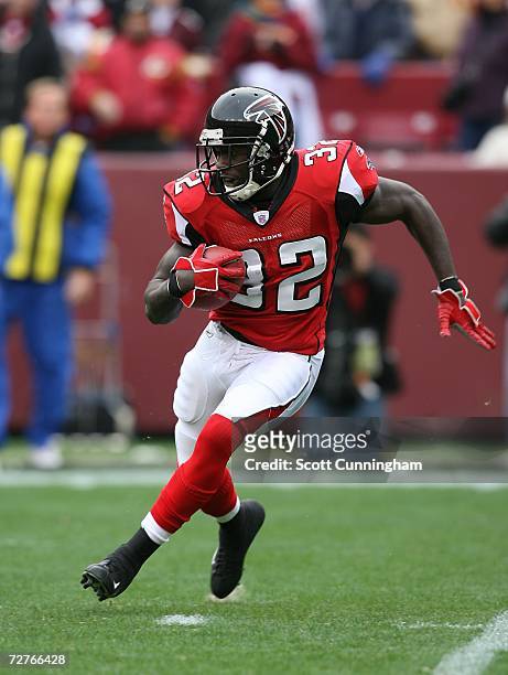 Jerious Norwood of the Atlanta Falcons runs against the Washington Redskins at the FedEx Field on December 3, 2006 in Landover, Maryland. The Falcons...