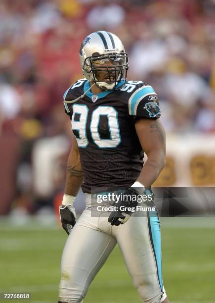 Julius Peppers of the Carolina Panthers walks on the field during the game against the Washington Redskins on November 26, 2006 at FedEx Field in...