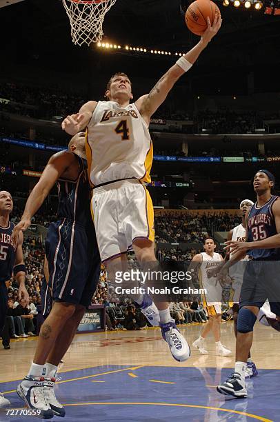 Luke Walton of the Los Angeles Lakers takes the ball to the basket against the New Jersey Nets during the game at Staples Center on November 26, 2006...