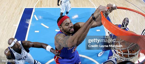 Rasheed Wallace of the Detroit Pistons dunks the ball over Erick Dampier of the Dallas Mavericks during an NBA game on December 7, 2006 at the...