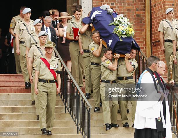 The coffin containing the body of Captain Mark Bingley is carried down the stairs to the waiting gun carriage at the conclusion of his military...