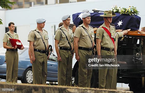 The coffin of Black Hawk helicopter pilot Captain Mark Bingley is placed on top of a gun carriage at the conculsion of his military funeral at St...
