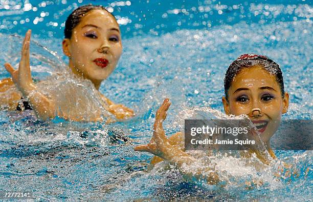 Tokgo Pom and Wang Ok Gyong of North Korea perform their routine during the Synchronised Swimming Duet Technical Routine at the 15th Asian Games Doha...