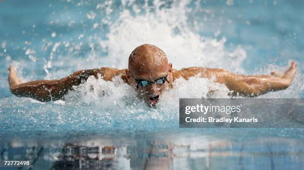 Michael Klim competes in the Men's 100m Butterfly semi final on day six of the Australian Championships at Chandler Aquatic Centre on December 8,...